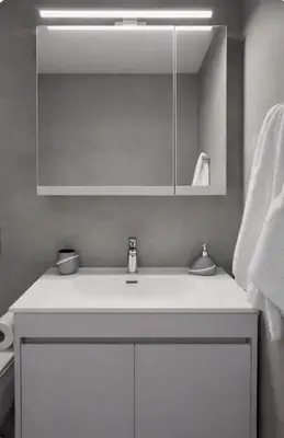 a bathroom with a white sink and a mirror at EL GRECO Penthouse in Vibrant Petralona in Athens