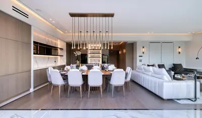 a living room with a table and a white couch at The One Acropolis in Athens
