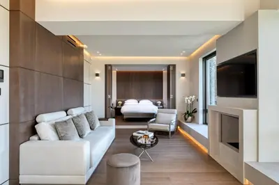 a living room with a couch and a bed at The One Acropolis in Athens