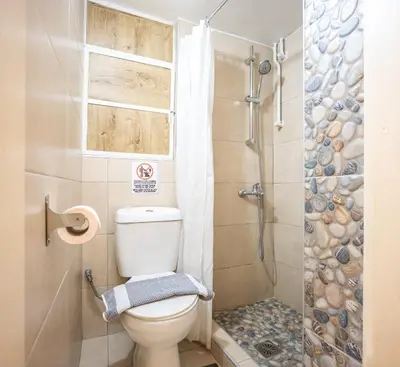 a bathroom with a toilet and a shower at Zacharitsa APT at Acropolis up 4 guests by LODGESPOT in Athens