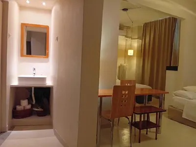 a room with a dining room table and a bathroom at Zacharitsa APT at Acropolis up 4 guests by LODGESPOT in Athens