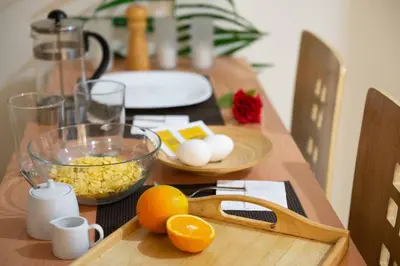 a wooden table with eggs eggs and oranges on it at Zacharitsa APT at Acropolis up 4 guests by LODGESPOT in Athens