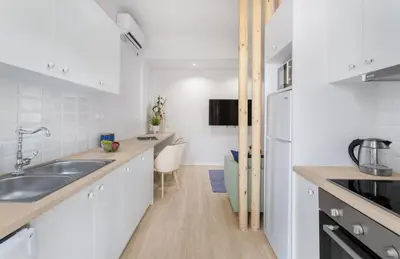 a kitchen with a sink and a counter top at Modern & Stylish Hideaway Downtown near Acropolis & Metro in Athens