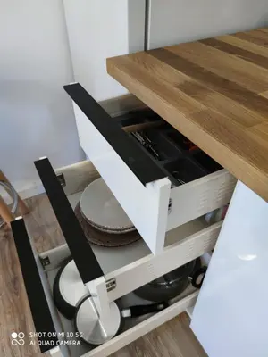 a drawer in a kitchen with a table at Studio in Kallithea next to Kiprou square in Athens