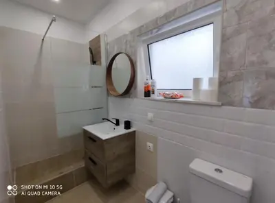 a bathroom with a sink and a mirror at Studio in Kallithea next to Kiprou square in Athens