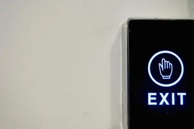 an exit sign is shown next to a wall at WYN Comfort Studio in Kallithea Near SNFCC and Seasi in Athens