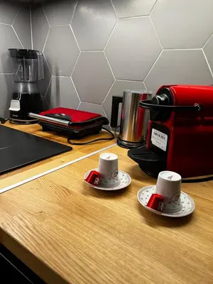 a counter with two cups and a coffee maker at WYN Comfort Studio in Kallithea Near SNFCC and Seasi in Athens
