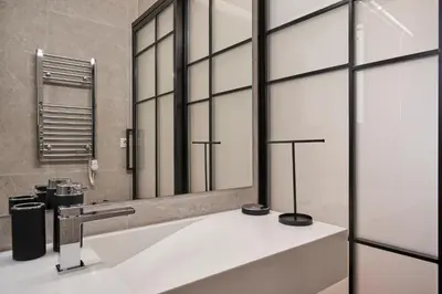 a bathroom with a sink and a mirror at Charitos Boutique Apartment, Kolonaki in Athens