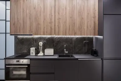 a kitchen with a sink and a stove at Charitos Boutique Apartment, Kolonaki in Athens