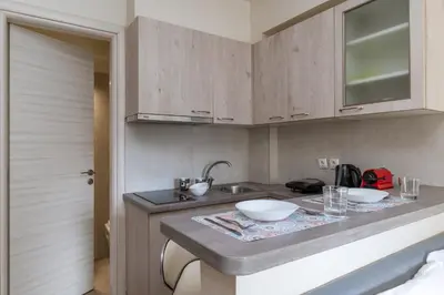 a kitchen with a counter with two bowls on it at Elvita Apartments 3 in Athens