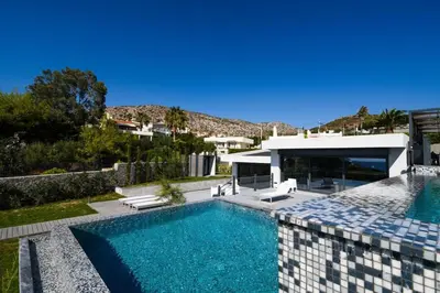 an image of a swimming pool with a house at Black Diamond Luxury Beachfront Villa Selenia in Sounio