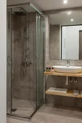 a bathroom with a shower and a sink at STAY INN in Athens