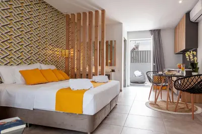 a bedroom with a large bed and a table at STAY INN in Athens
