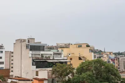 a group of buildings in a city at Mid century 3 bdr city centre townhouse in Athens