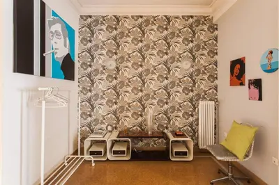 a living room with a couch and a wallpaper at Mid century 3 bdr city centre townhouse in Athens