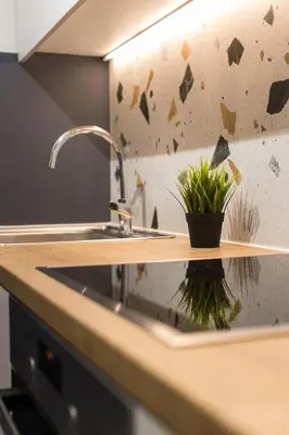 a kitchen sink with a potted plant on it at Serene 1 BR Apartment in Koukaki by UPSTREET in Athens