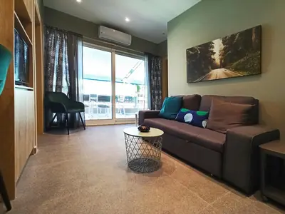 a living room with a couch and a table at Athens Sweet Home by YHA in Athens