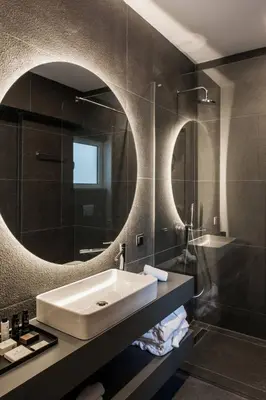 a bathroom with a sink and a mirror at 5BD 2 Level Beachfront Luxury Apt by the Olon in Athens