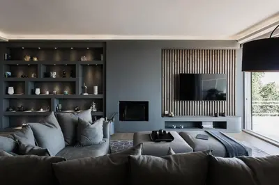 a living room with a couch and a television at 5BD 2 Level Beachfront Luxury Apt by the Olon in Athens