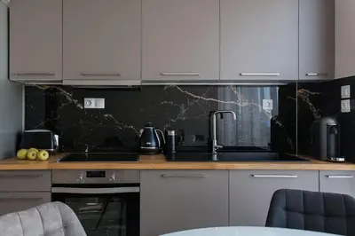 a kitchen with a sink and a counter top at 5BD 2 Level Beachfront Luxury Apt by the Olon in Athens