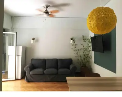 a living room with a couch and a ceiling fan at Eleni's Central DownTown Quitness in Athens
