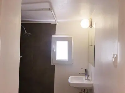 a bathroom with a sink and a window at Eleni's Central DownTown Quitness in Athens