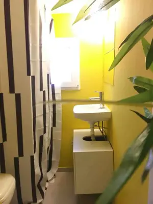 a bathroom with a sink and a toilet at Eleni's Central DownTown Quitness in Athens