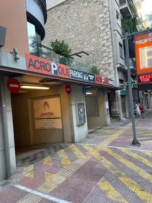 a store with a sign on the side of a street at Eleni's Central DownTown Quitness in Athens