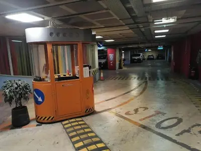 an empty parking garage with a machine in the middle at Eleni's Central DownTown Quitness in Athens