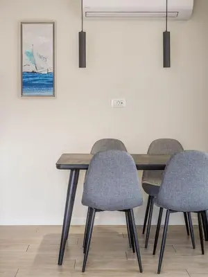 a dining room table and four chairs in a room at Hestia - Ippokratous 35 in Athens
