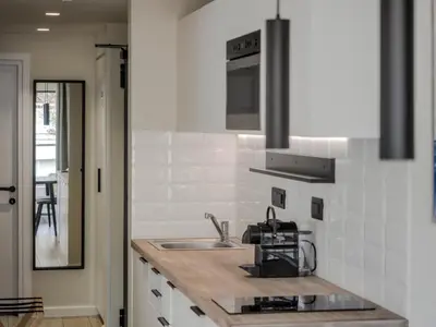 a kitchen with a sink and a microwave at Hestia - Ippokratous 35 in Athens