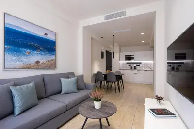 a living room with a couch and a table at Hestia - Ippokratous 35 in Athens