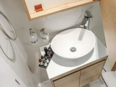 a bathroom with a white sink and a shower at Hestia - Ippokratous 35 in Athens