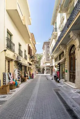 an empty street in a city with buildings at Athens' Best Location- Stunning & Spacious Studio in Athens