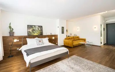 a bedroom with a large bed and a couch at Athens' Best Location- Unique Magnificent Studio in Athens