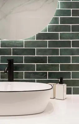 a bathroom with a sink and a brick wall at Athens' Best Location- Unique Magnificent Studio in Athens