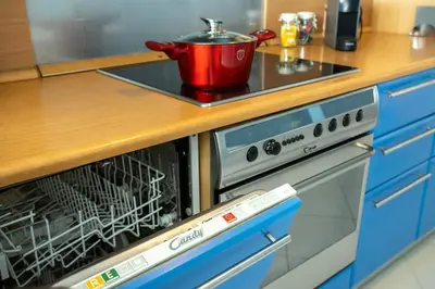 a dishwasher with a pot on top of it in a kitchen at AthensBlues Kolonaki 2 Bedroom with Car Park in Athens