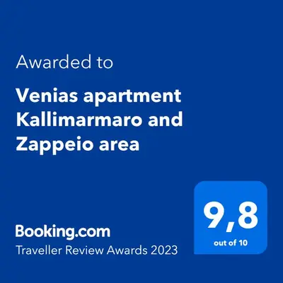 a blue sign with the text awarded to venus apartment kalamazoo at Venias Two-Bedroom apartment Kallimarmaro and Zappeio area in Athens