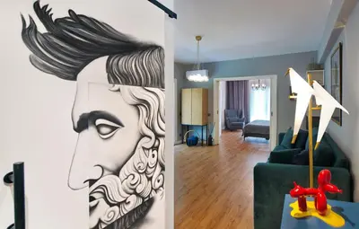 a living room with a painting of a woman at Five Seasons Alimos in Athens