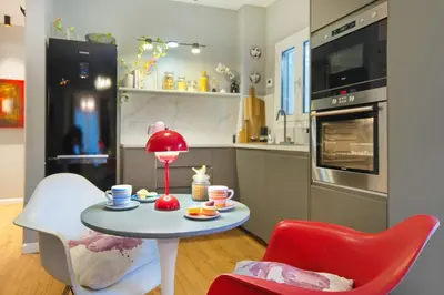 a kitchen with a table and two chairs at Five Seasons Alimos in Athens