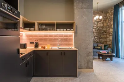 a kitchen with a sink and a counter at Cohort Koukaki in Athens