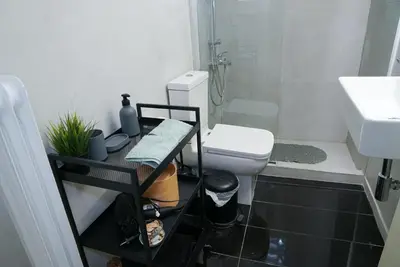 a small bathroom with a toilet and a sink at Comfy studio apartment very close to city centre in Athens
