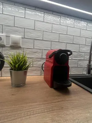 a red toaster sitting on top of a kitchen counter at 2 Bedroom Acropolis Apartment in Athens