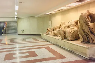 a museum room with a statue of recliningummies at 2 Bedroom Acropolis Apartment in Athens