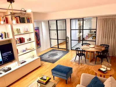 a living room with a couch and a table at Luxury 2 bedroom 2 bathroom flat in Kolonaki ! in Athens