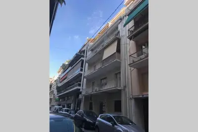 a street with cars parked in front of buildings at Luxury 2 bedroom 2 bathroom flat in Kolonaki ! in Athens
