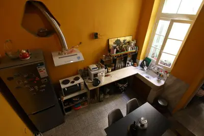 an overhead view of a kitchen with a refrigerator at The monumental house in Athens
