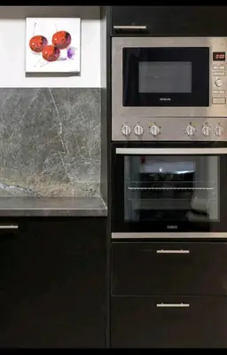 a kitchen with a stove and a microwave at DELUXE ROMANTIC JACUZZI in Athens