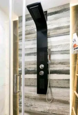 a black hair dryer hanging on a wall at DELUXE ROMANTIC JACUZZI in Athens