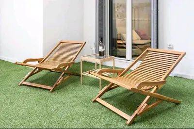 two chairs and a table in a room with grass at DELUXE ROMANTIC JACUZZI in Athens